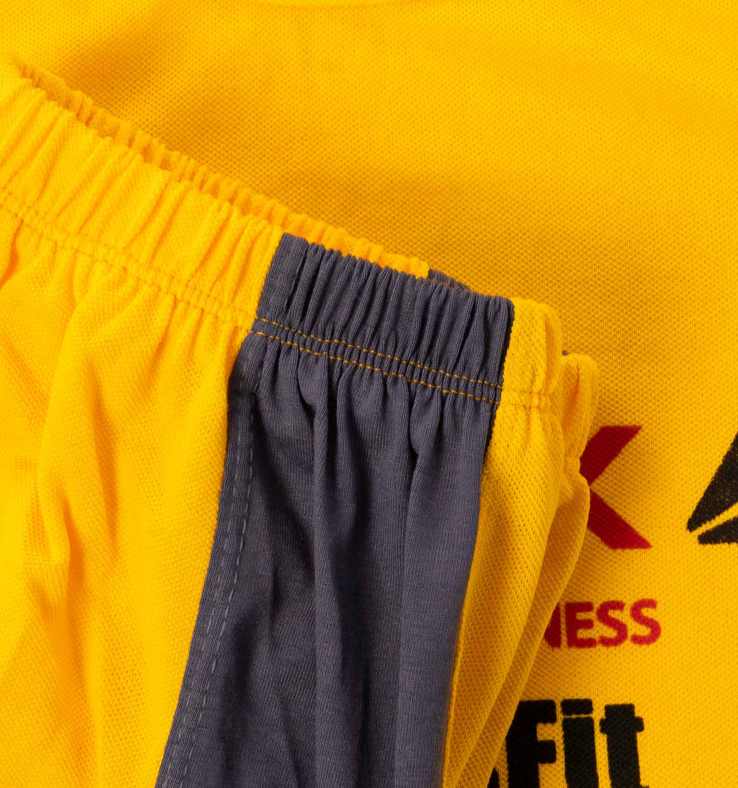 ست رکابی شلوارک مردانه آستین حلقه ای زرد Reebok ساده یقه گرد مدل 43939