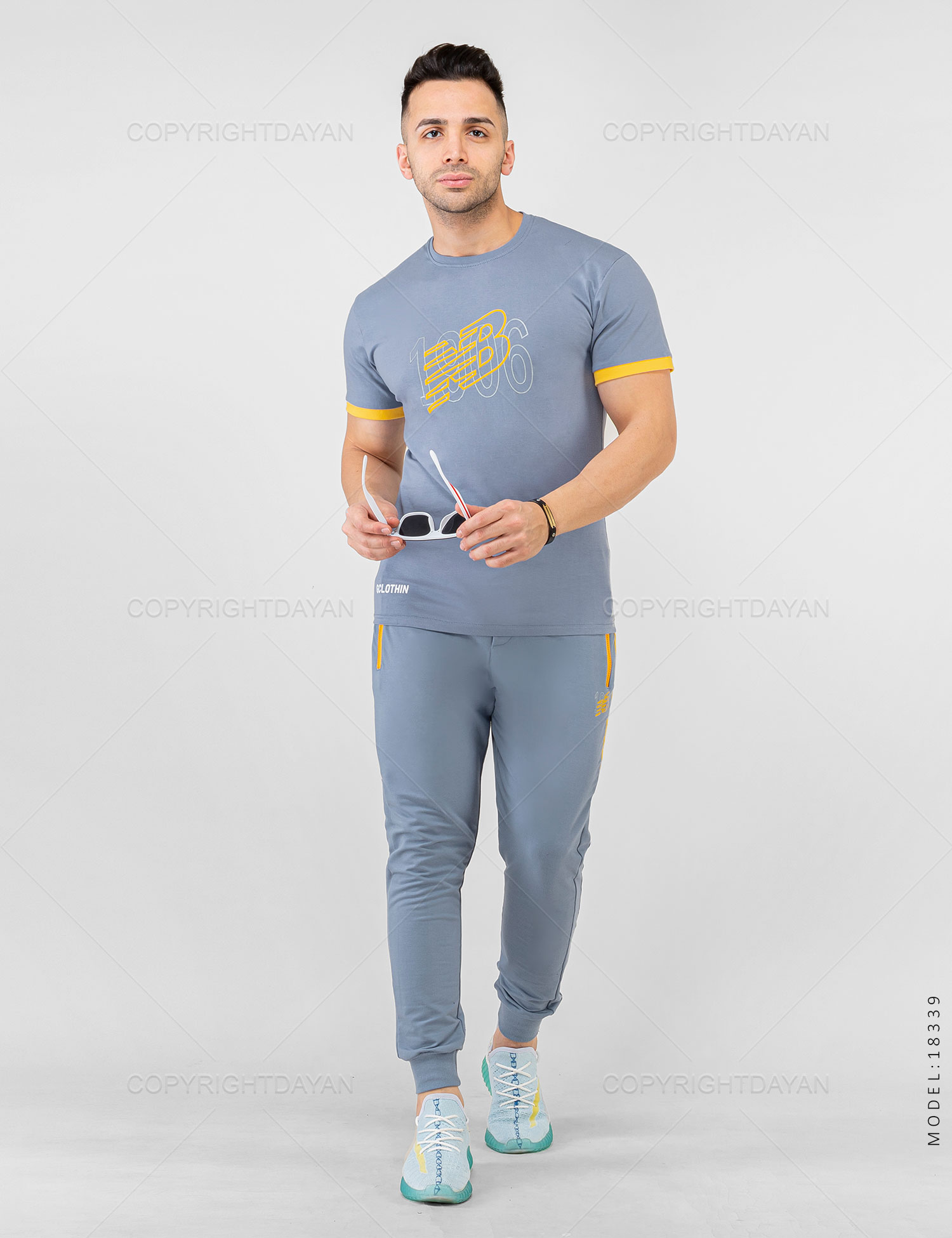 ست تیشرت شلوار مردانه New Balance مدل 18339