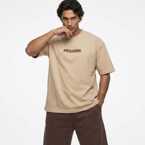 تیشرت Pegador یقه گرد مردانه باکسی دورس پنبه طرحدار مدل 50121