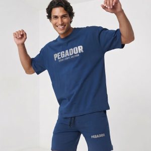 ست تیشرت شلوارک مردانه باکسی طرحدار مچینست آبی Pegador مدل 50913